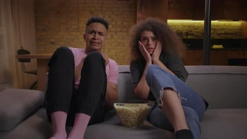 Scared Couple Watches a Terrifying Movie at Home