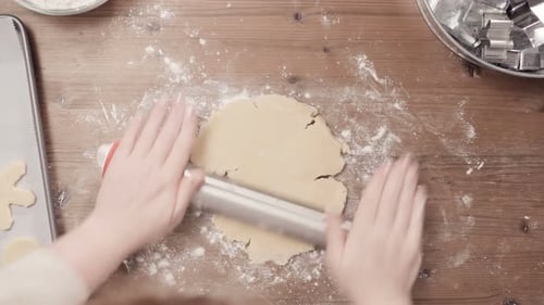 Rolling Cookie Dough on Wood Table