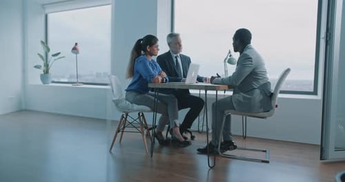 Business Meeting in a Bright, Modern Office