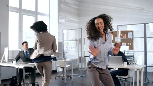 Young Business Team Dancing in Office