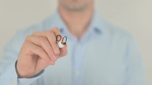 Writing Payment Due with Marker on Glass Surface