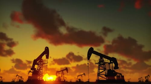 Working Oil Pumpjacks Silhouette at Sunset