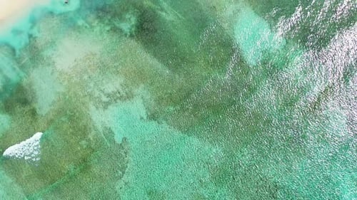 Aerial panorama of tropical lagoon beach voyage by aqua blue lagoon and white sandy background of a