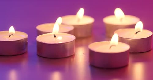 Many small flaming candles