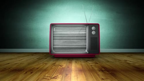 Zoom in of old TV turning on and no signal in a room with wooden floor