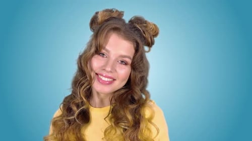 Smiling Young Woman with Curly Hair Posing Portrait
