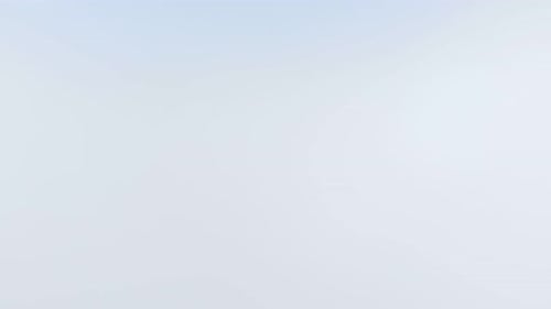 Aerial drone flying over clouds morning fog mist covering valley