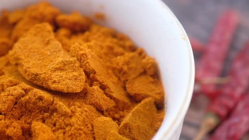 Close-Up of Orange Powder in White Bowl