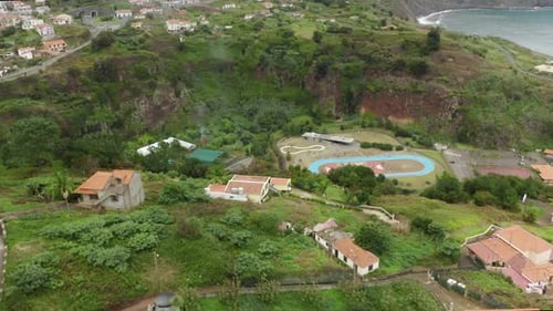 Aerial View of Picturesque Coastal Village and Greenery