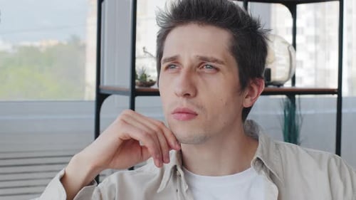 Man Thinking, Pondering at Home During the Day