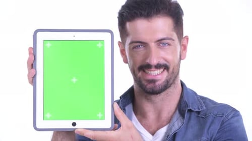 Man Holds Tablet with Green Screen for Chroma Key