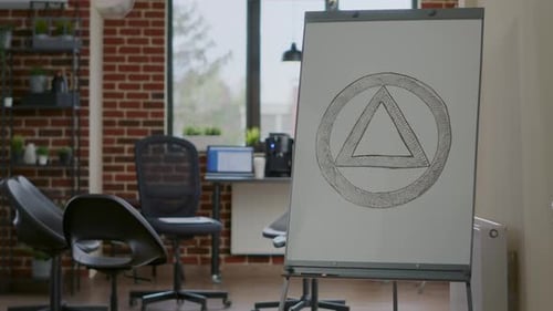 Close Up of Aa Meeting Symbol on White Board in Counseling Office