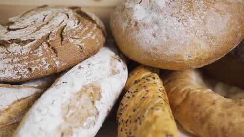 Artisanal Bread Variety Displayed on Wooden Surface