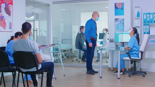 Senior Man at Hospital Reception During COVID19