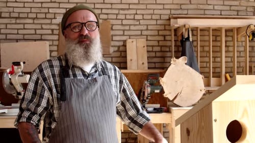 Man with Beard Standing in Carpentry Workshop