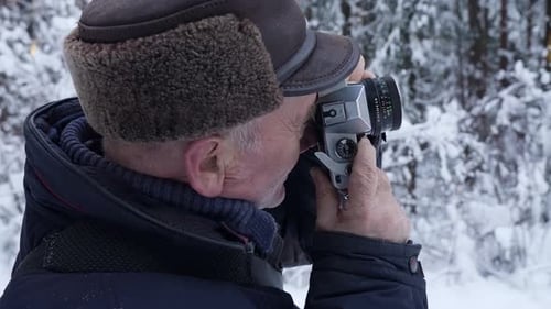 Amateur Photographer Is Taking Picture of Winter Nature in Forest Snowy Woodland with Trees