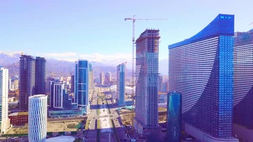 The process of construction of high-rise modern buildings in the city center.