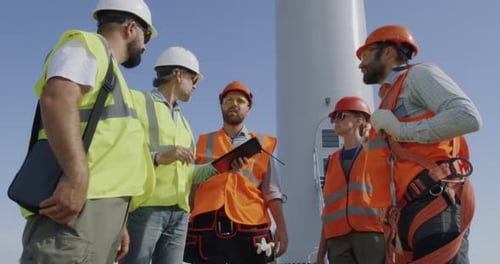 Builders Discussing Power Plant Construction