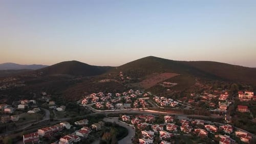 Scene with Cottages and Green Hills in Trikorfo, Beach, Greece