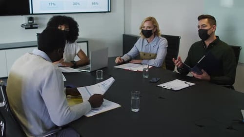 Coworkers Meet at Modern Office Wearing Face Masks