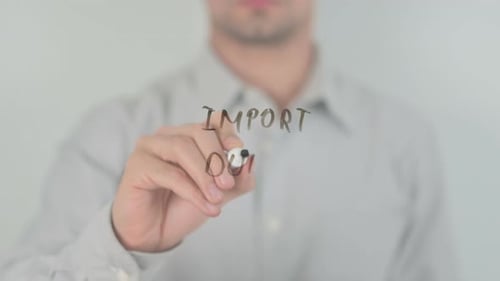 Writing Import Duty on Clear Surface with Marker