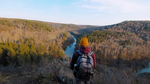 Woman and Dog Walk on Hill Slope