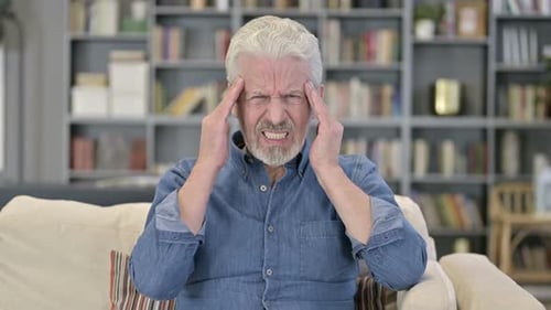 Senior Man Suffering From a Headache
