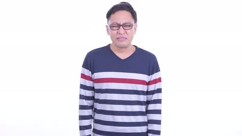 Emotional Man Crying in Front of White Background