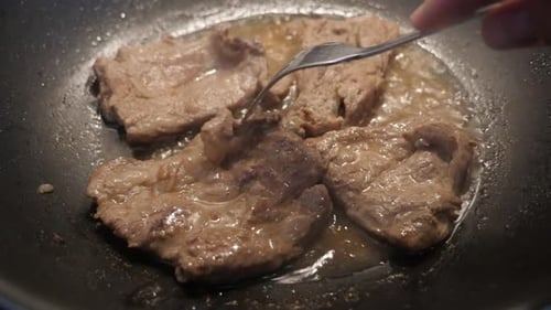 Close-up of preparing meat in hot oil slow motion 1920X1080 HD footage - Tasty looking pork steaks i
