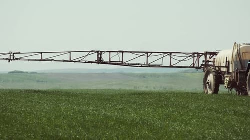 Tractor With A Sprayer Work In The Field
