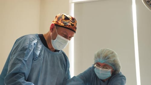 Surgeons Performing Operation in Hospital Operating Room