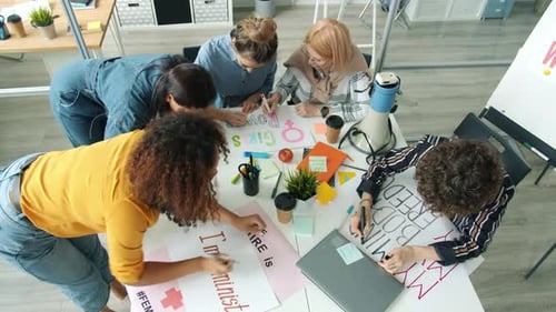Group of Active Women Feminists Making Posters for Gender Equality Social Movement