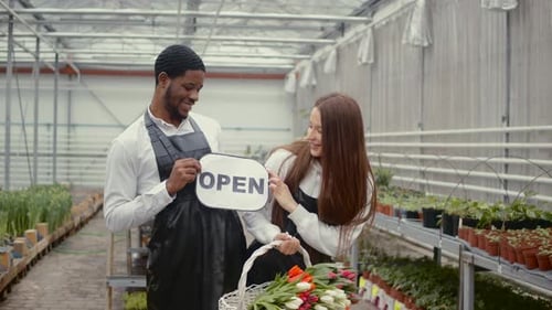 Two Florists Working at Flower Indoor Plantation