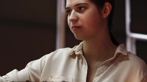 Woman Painting Indoors in Art Studio