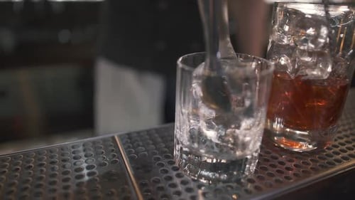 Small Glass Standing on Bar Counter