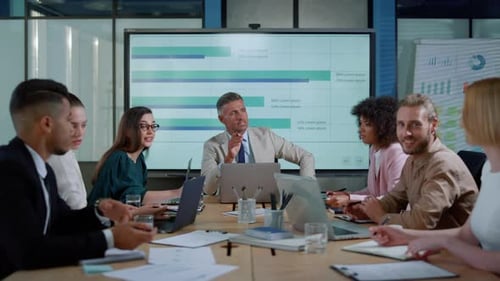 Diverse Group Discussing Business Strategy in Office