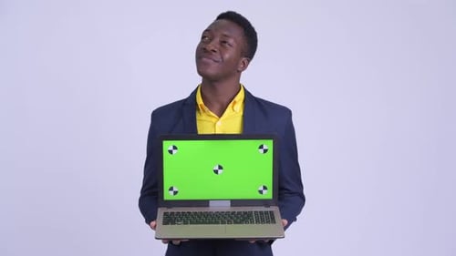 Young Man Holding Laptop with Green Screen
