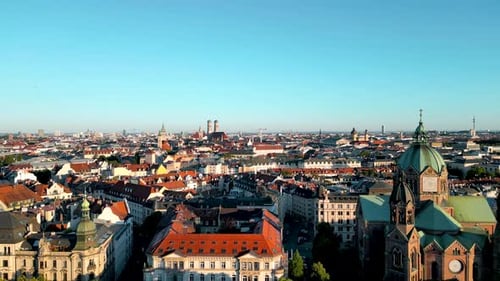 Panorama aerial view Munich downtown sunrise. Drone flies over residential area of central bavarian