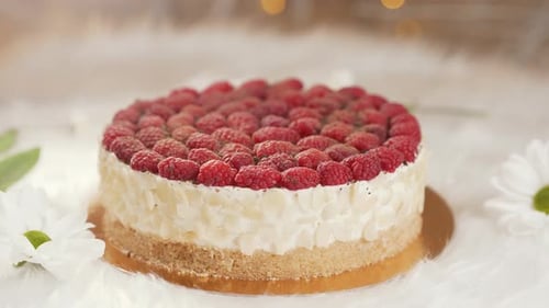 Delicious Raspberry Cake with White Flowers and Lighting