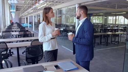 Colleagues Talking in a Modern Office Building