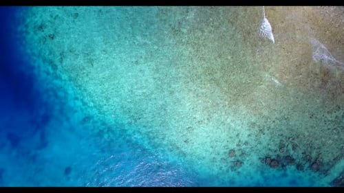 Aerial texture of marine seashore beach holiday by blue ocean and white sandy background of a dayout