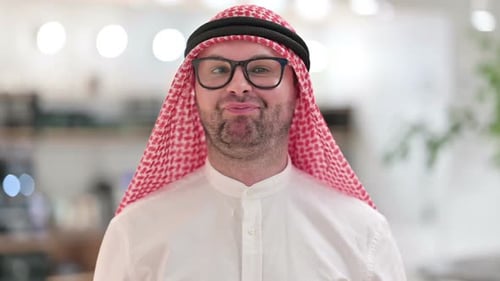 Man with Headscarf Looking at Camera Close Up