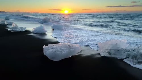 Ice From a Glacier Washing By Atlantic Ocean Waves on a Black Diamond Beach in Iceland. Global