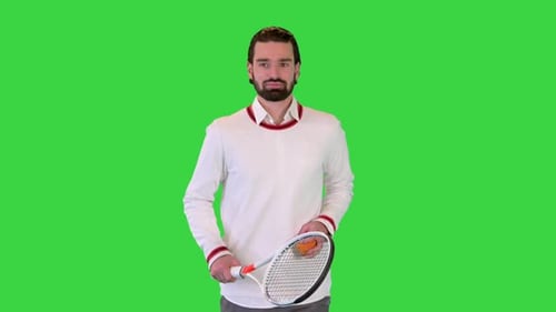 Handsome Tennis Player Running with Tennis Racket on a Green Screen Chroma Key