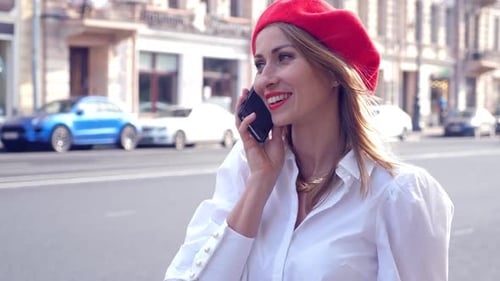 Stylish Woman in Red Beret Talking on Phone