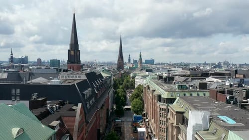 Descending Shot of Historic City Centre with Known Landmarks Churches and Old Buildings