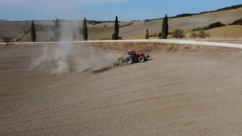 Tractor preparing rural field, wheat cultivation plowing ground soil aerial view