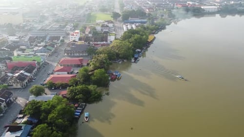 Aerial view passenger boats leave Teluk Intan jetty
