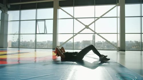 Slow Motion of Fit Young Lady Training Abdominal Muscles Exercising Alone in Modern Gym
