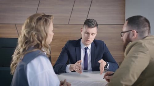 Consultant Meeting with Man and Woman in Office